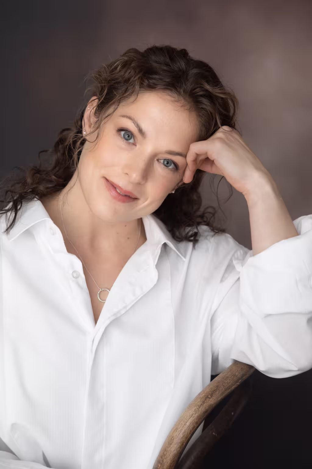 Studio portrait Portrait of a young woman in a white shirt